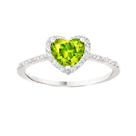 Peridot ring with a 6 mm heart cut, crafted in white gold-plated 925 silver and accented with moissanite. Available now at BSI Jewelry.