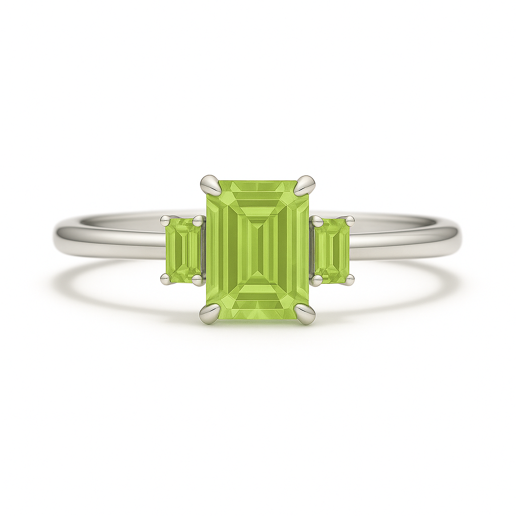 Elegant peridot ring with 6×4 mm and 4×2 mm emerald-cut stones in white gold-plated 925 silver with palladium alloy. Fresh brilliance. Available at BSI Jewelry.