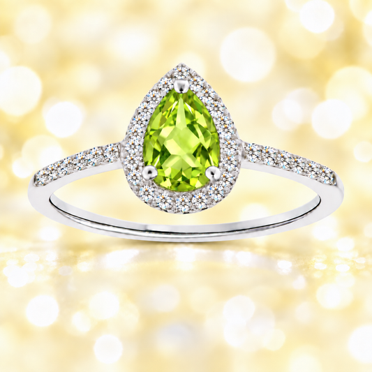 Peridot ring with a 7×5 mm pear cut, with moissanite in white gold-plated 925 silver. Elegant and timeless for daily wear. Available now at BSI Jewelry.
