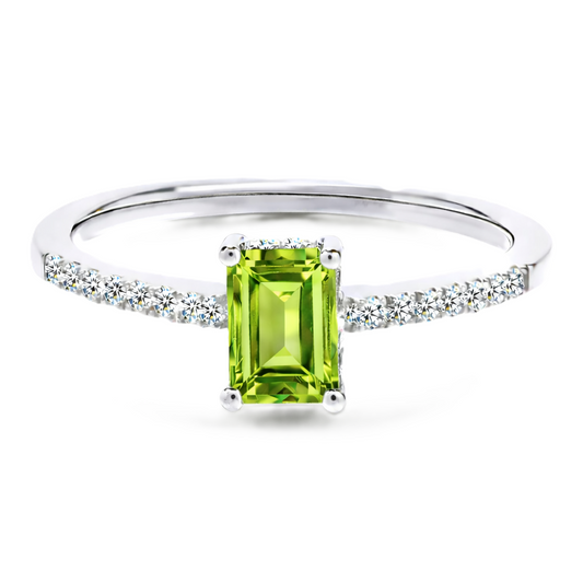 Peridot ring with a 7×5 mm emerald cut in white gold-plated 925 silver, with moissanite. Elegant and refined for daily wear. Available now at BSI Jewelry.