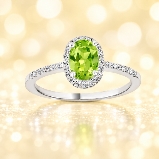 Peridot ring with a 7×5 mm oval-cut in white gold-plated 925 silver, accented with moissanite. Elegant and refined for daily wear. Available now at BSI Jewelry.