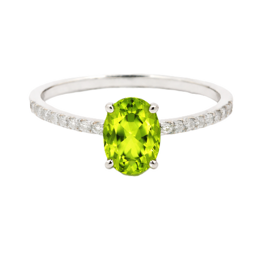 Peridot ring with a 7×5 mm oval-cut stone and moissanite accents in white gold plated 925 silver. Elegant for daily wear. Available now at BSI Jewelry.