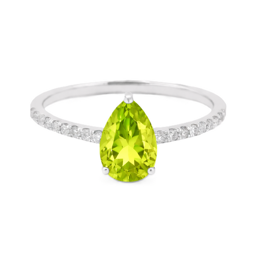 Peridot ring with a 7×5 mm pear-cut stone and moissanite accents in white gold plated 925 silver. Elegant for daily wear. Available now at BSI Jewelry.