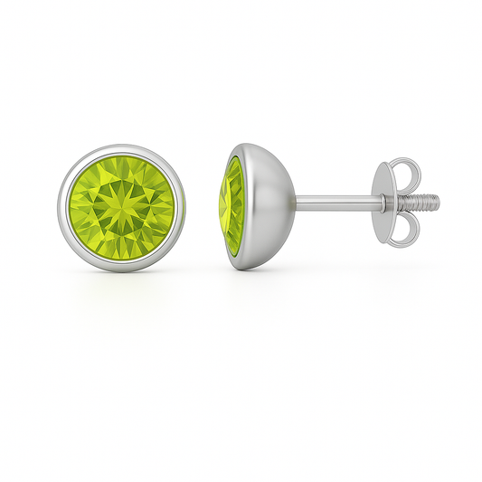 Peridot stud earrings, 5 mm round brilliant, crafted in white gold-plated 925 silver with palladium alloy. Elegant and hypoallergenic. Available at BSI Jewelry.