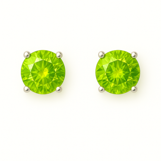 Fresh peridot stud earrings in white gold-plated 925 silver with prong setting. Bright brilliance and hypoallergenic, safe to wear. Available at BSI Jewelry.