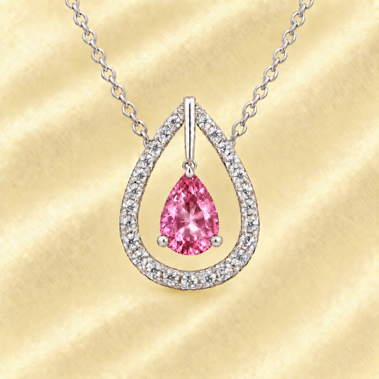 Pink amethyst necklace with a 7×5 mm pear-cut in white gold-plated 925 silver, accented by a moissanite halo. Elegant and refined. Available now at BSI Jewelry.