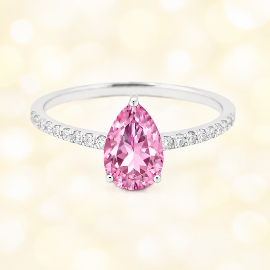 Pink amethyst ring with a 7×5 mm pear-cut stone and moissanite accents in white gold plated 925 silver. Elegant for daily wear. Available now at BSI Jewelry.