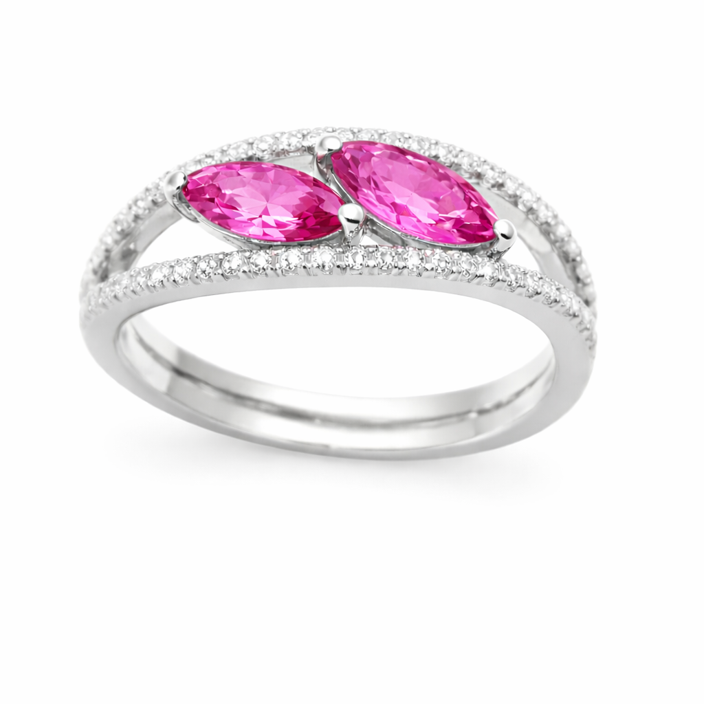 Pink sapphire crossover ring with 6×3 mm marquise in white gold-plated 925 silver, accented with moissanite. Elegant and contemporary. Available now at BSI Jewelry.