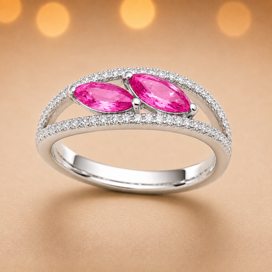 Pink sapphire crossover ring with 6×3 mm marquise in white gold-plated 925 silver, accented with moissanite. Elegant and contemporary. Available now at BSI Jewelry.