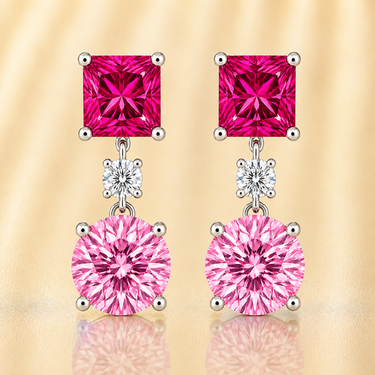 Romantic pink sapphire drop stud earrings with 5 mm princess and round, crafted in white gold-plated 925 silver with palladium-added alloy. Now at BSI Jewelry.