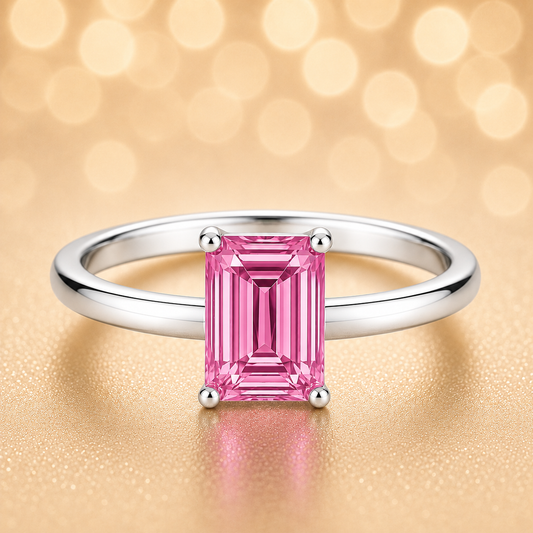 7×5 mm emerald-cut pink sapphire solitaire ring set in white-gold-plated 925 silver. Radiant hue, timeless elegance, and refined simplicity. Now at BSI Jewelry.