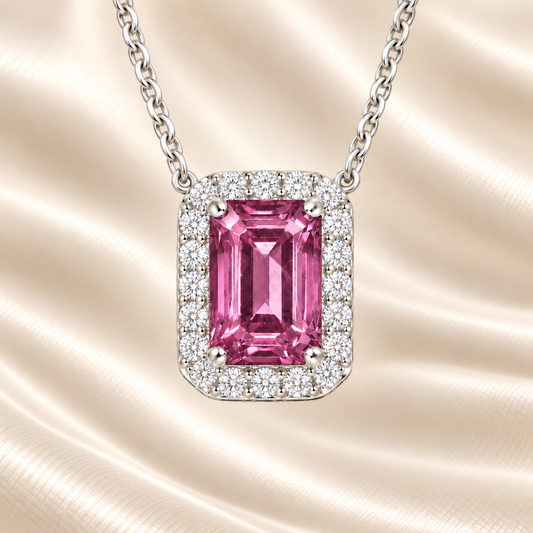 Pink sapphire emerald cut necklace with 7×5 mm center stone in white gold-plated 925 silver. Elegant and feminine for everyday wear. Available now at BSI Jewelry.