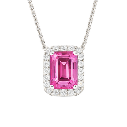 Pink sapphire emerald cut pendant with 7×5 mm center stone in white gold-plated 925 silver. Elegant and feminine for everyday wear. Available now at BSI Jewelry.