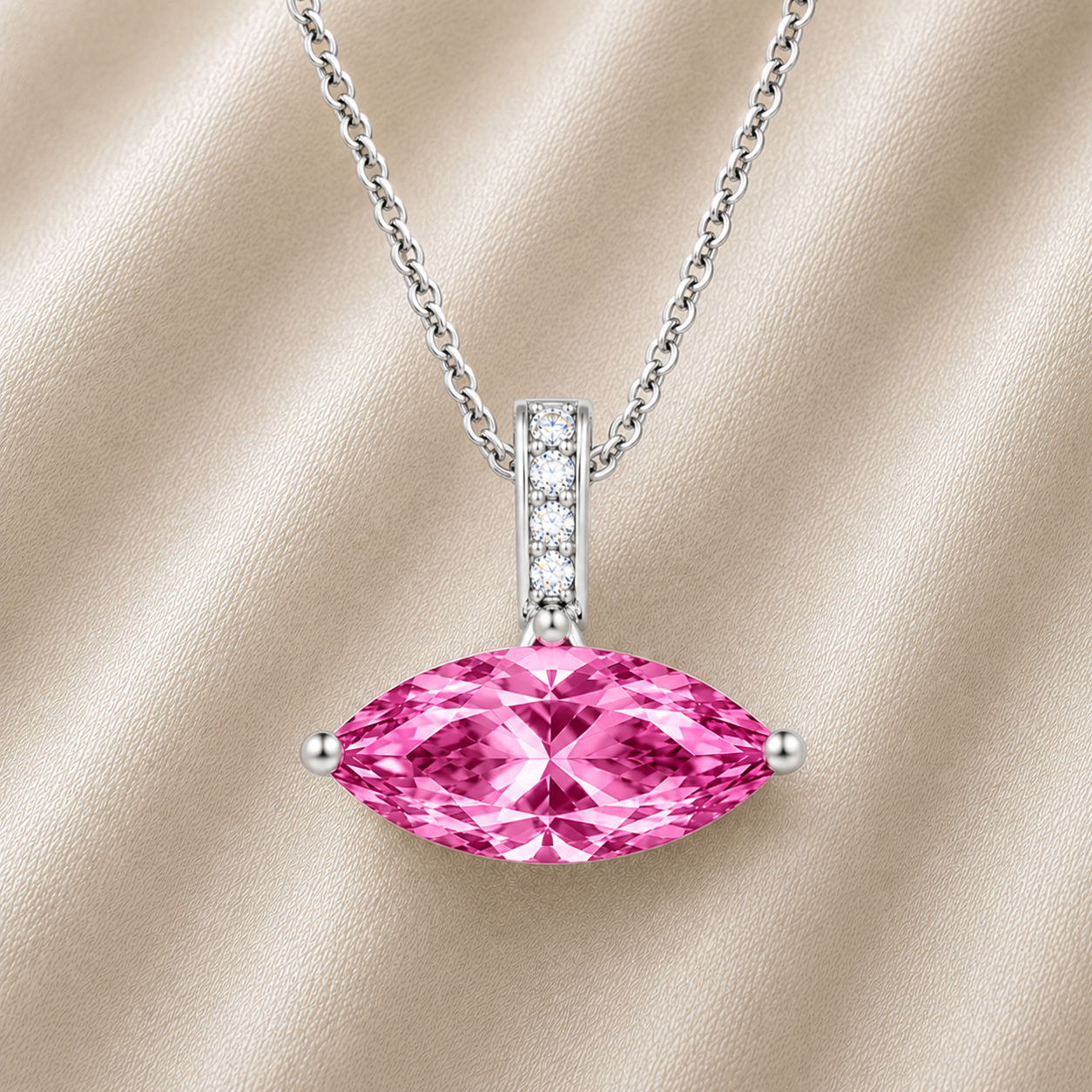 Pink sapphire marquise pendant with an 8×5 mm gemstone in white gold-plated 925 silver with moissanite accents. Elegant and refined. Available now at BSI Jewelry.