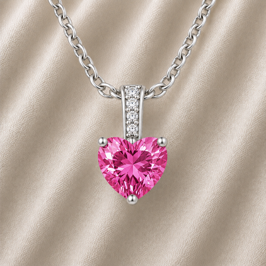 Pink sapphire pendant with a 6 mm heart cut, crafted in white gold-plated 925 silver. Elegant and refined for daily wear. Available now at BSI Jewelry.