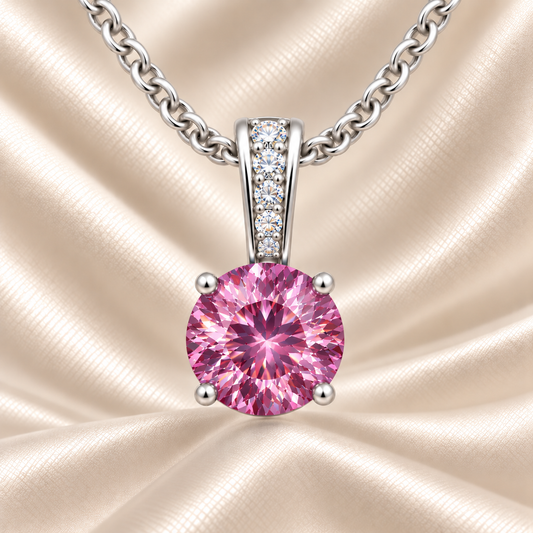 Pink sapphire pendant with a 6 mm round cut, set in white gold-plated 925 silver. Elegant, soft, and refined for daily wear. Available now at BSI Jewelry.