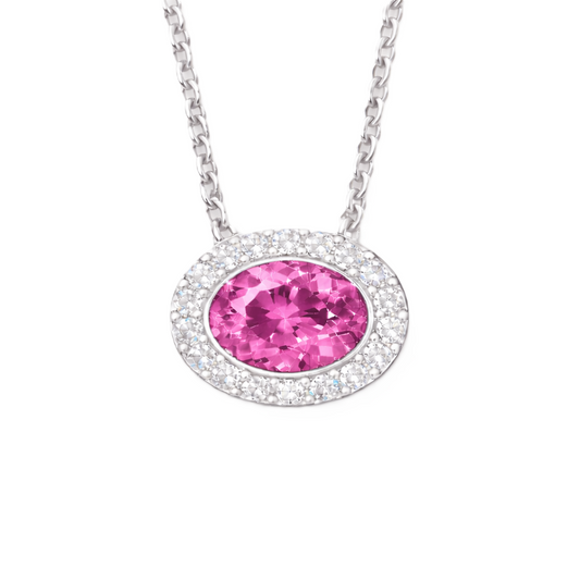 Pink sapphire pendant with a 7×5 mm oval stone in white gold-plated 925 silver, accented with moissanite. Elegant and radiant. Available now at BSI Jewelry.