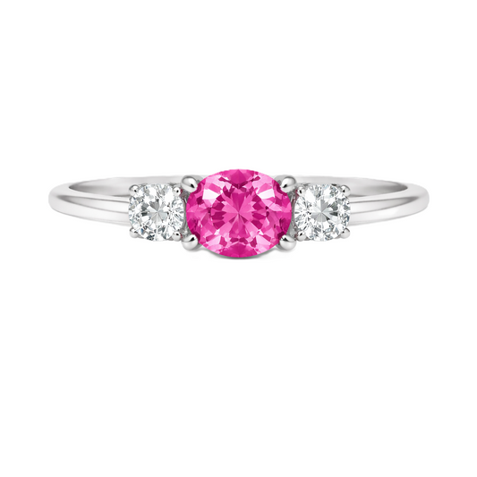 Pink sapphire ring, 5×4 mm oval with moissanite accents in white gold-plated 925 silver. Elegant and hypoallergenic. Available now at BSI Jewelry.