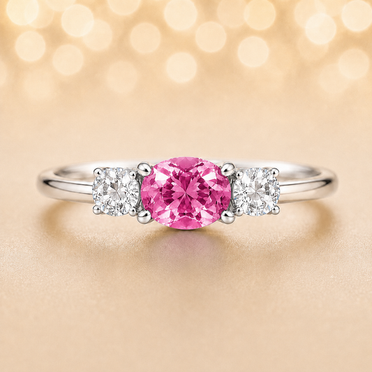 Pink sapphire ring, 5×4 mm oval with moissanite accents in white gold-plated 925 silver. Elegant and hypoallergenic. Available now at BSI Jewelry.