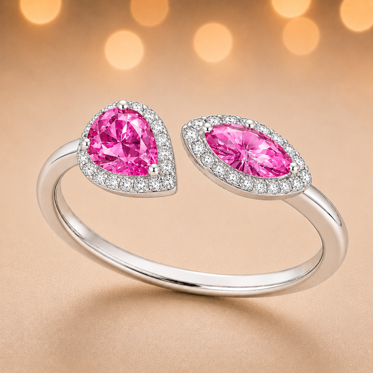 Pink sapphire ring with 6×3 mm pear and marquise cuts, crafted in white gold-plated 925 silver with moissanite accents. Available now at BSI Jewelry.