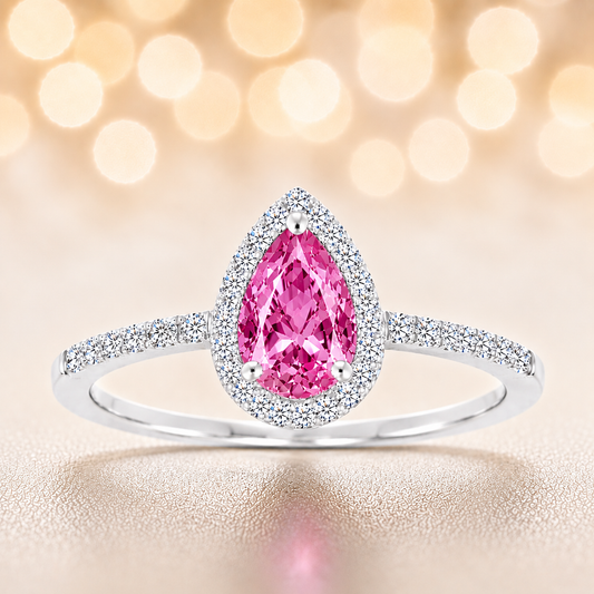 Pink sapphire ring with a 7×5 mm pear cut, with moissanite in white gold-plated 925 silver. Elegant and timeless for daily wear. Available now at BSI Jewelry.