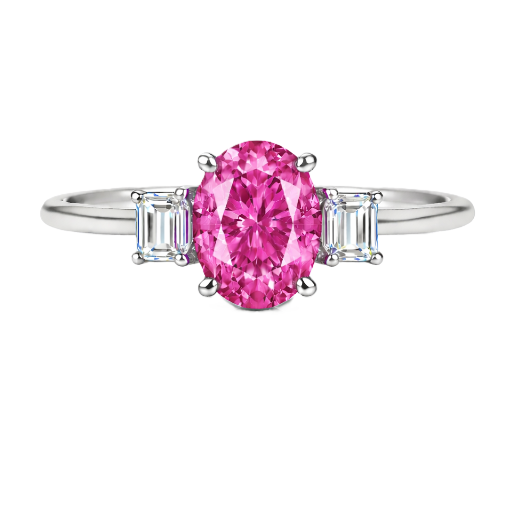 Pink sapphire ring with 7×5 mm oval center and 5×3 mm moissanite sides in white gold-plated 925 silver. Elegant and refined. Available now at BSI Jewelry.