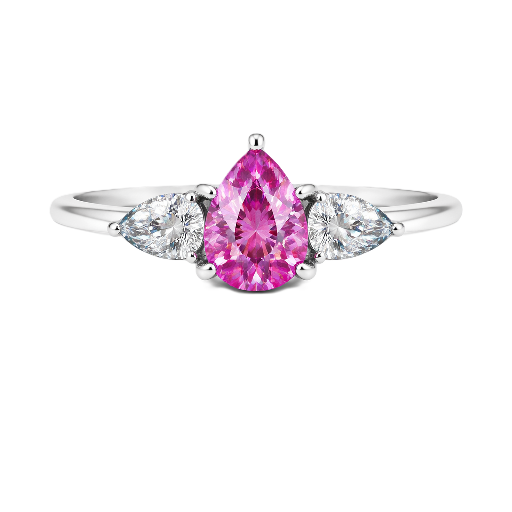 Pink sapphire ring with 7×5 mm pear center and side stones in white gold-plated 925 silver. Elegant and feminine for daily wear. Available now at BSI Jewelry.