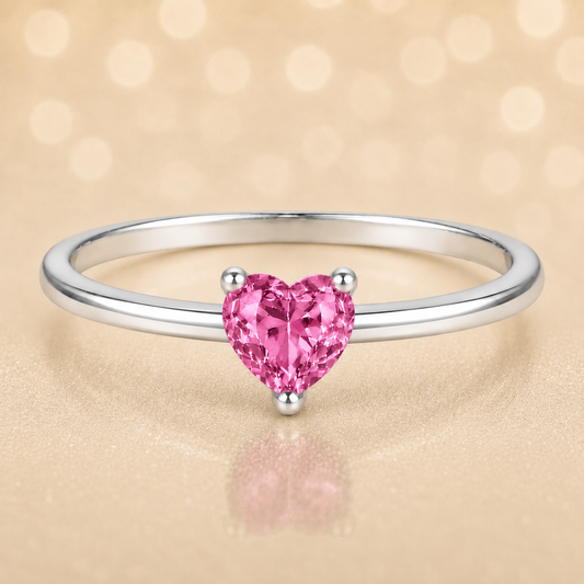 Pink sapphire solitaire ring with a 5 mm heart in white gold-plated 925 silver. Elegant, minimal, and timeless for daily wear. Available now at BSI Jewelry.