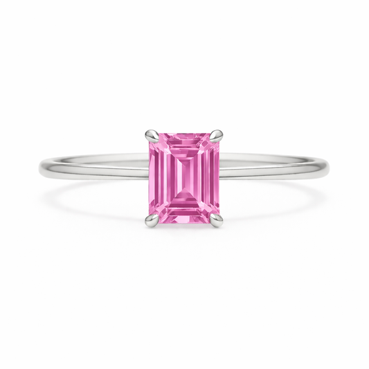 Elegant 6×4 mm emerald-cut pink sapphire ring crafted in white gold-plated 925 silver with palladium alloy. Timeless brilliance. Available now at BSI Jewelry.