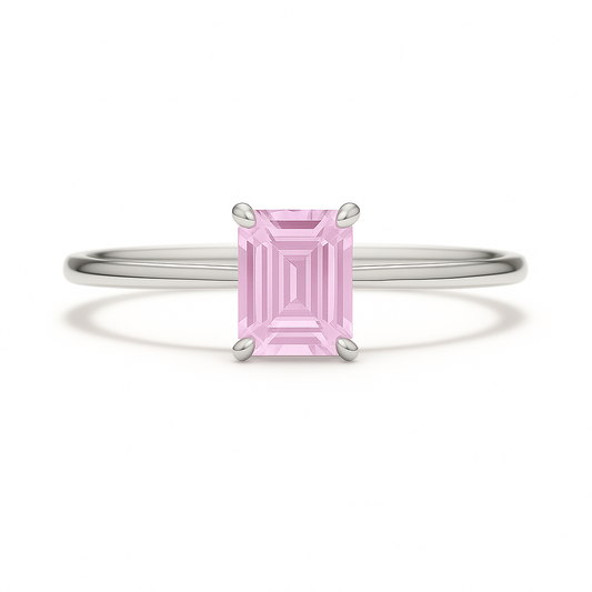 Elegant 6×4 mm emerald-cut pink sapphire ring crafted in white gold-plated 925 silver with palladium alloy. Timeless brilliance. Available now at BSI Jewelry.
