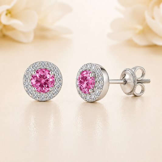 Pink sapphire stud earrings with 4 mm round cut in white gold-plated 925 silver, accented with moissanite and screw-back posts. Available now at BSI Jewelry.