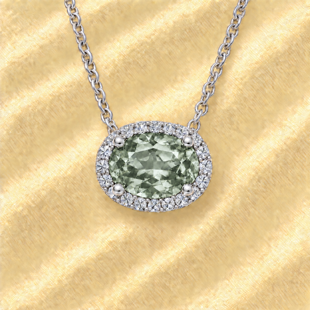 Moissanite and prasolite necklace with 9×7 mm oval gemstone in white gold-plated 925 silver with moissanite. Fresh and elegant. Available now at BSI Jewelry.