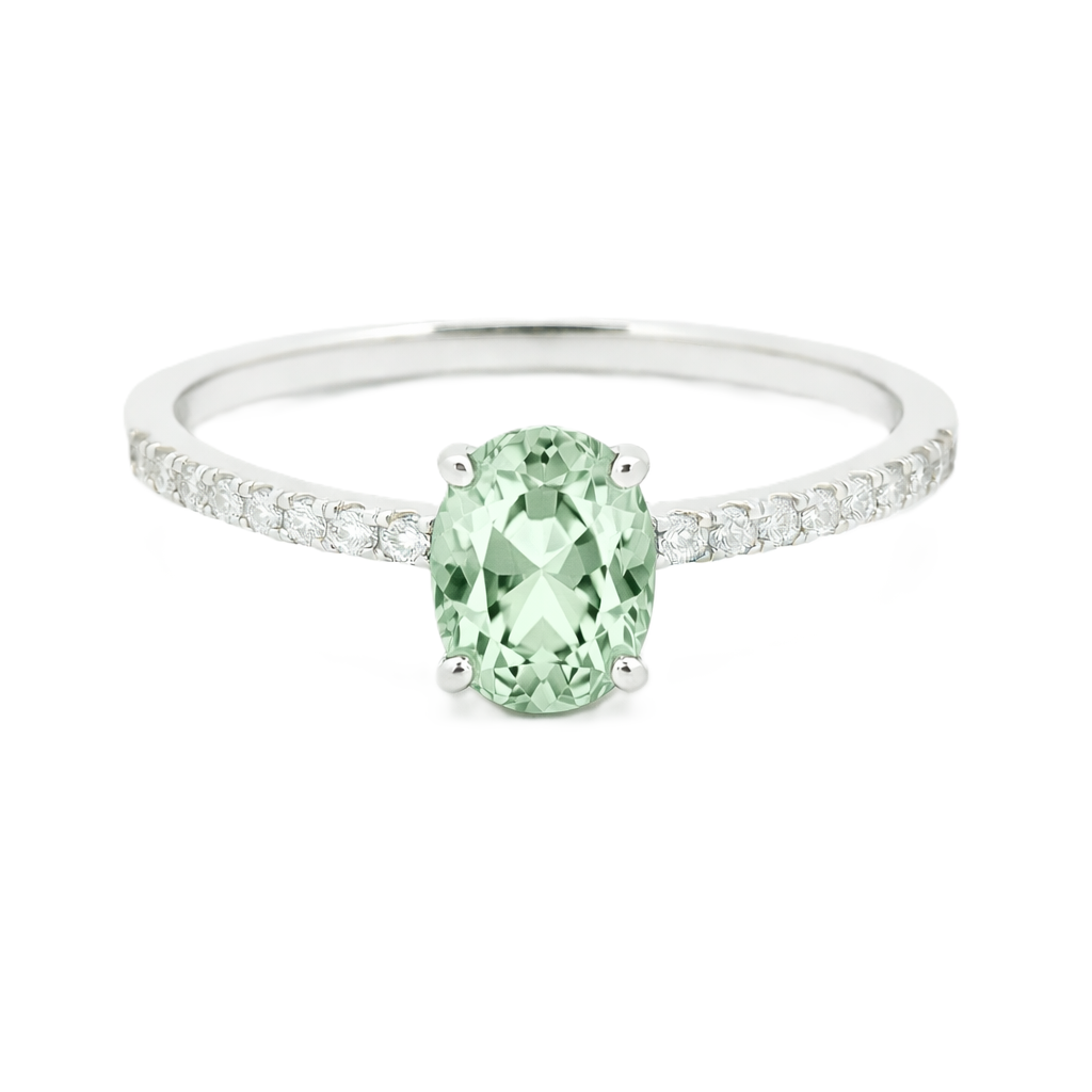 Prasolite ring with a 7×5 mm oval-cut stone and moissanite accents in white gold plated 925 silver. Elegant for daily wear. Available now at BSI Jewelry.