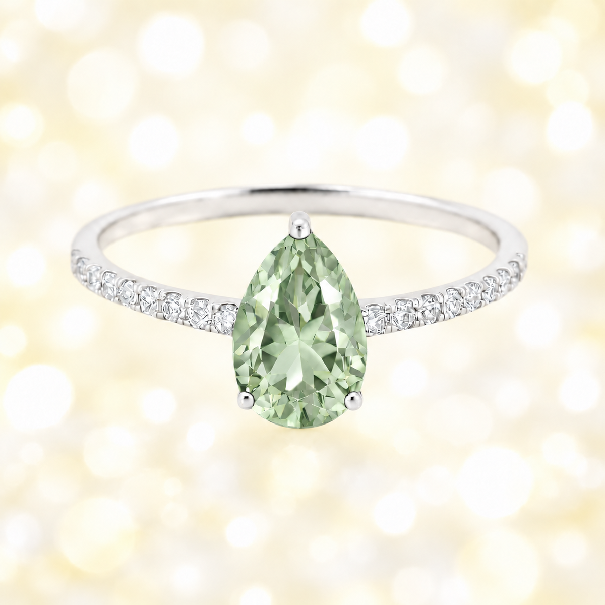 Prasolite ring with a 7×5 mm pear-cut stone and moissanite accents in white gold plated 925 silver. Elegant for daily wear. Available now at BSI Jewelry.