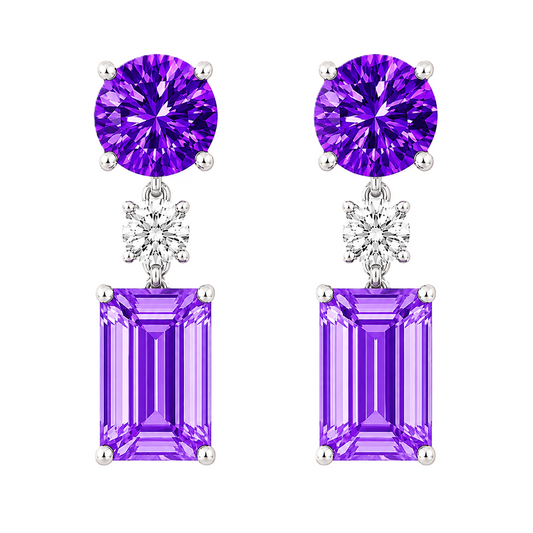 Purple sapphire drop earrings with 5mm round and 6×4mm emerald-cut, crafted in white gold-plated 925 silver with palladium-added alloy. Available at BSI Jewelry