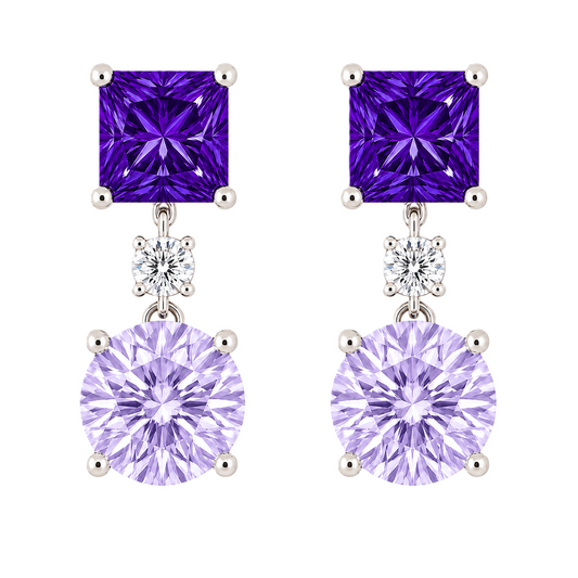 Purple sapphire earrings with 6 mm princess and round cuts, crafted in white gold-plated 925 silver. Elegant and colorful. Available now at BSI Jewelry.