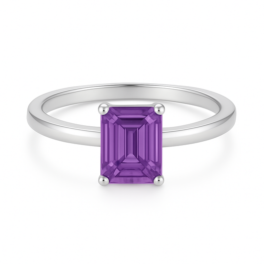 7×5 mm emerald-cut purple sapphire solitaire ring set in white-gold-plated 925 silver. Minimalist design with timeless elegance. Available now at BSI Jewelry.