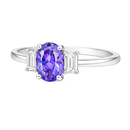 Purple sapphire engagement ring with 6×4 mm oval center and elegant three-stone design, crafted in white gold-plated 925 silver. Available now at BSI Jewelry.
