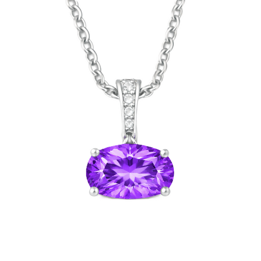 Purple sapphire oval pendant with an 8×5 mm gemstone in white gold-plated 925 silver, accented with moissanite. Elegant and refined. Available now at BSI Jewelry.