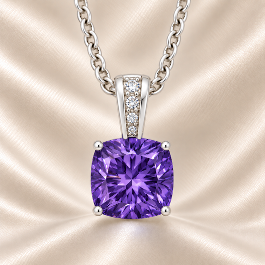 Purple sapphire pendant with a 6 mm cushion gemstone in white gold-plated 925 silver, accented with moissanite. Elegant and refined. Available now at BSI Jewelry.