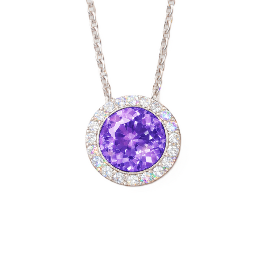 Purple sapphire pendant with 6 mm round stone in white gold-plated 925 silver, accented with moissanite and adjustable cable chain. Available now at BSI Jewelry.