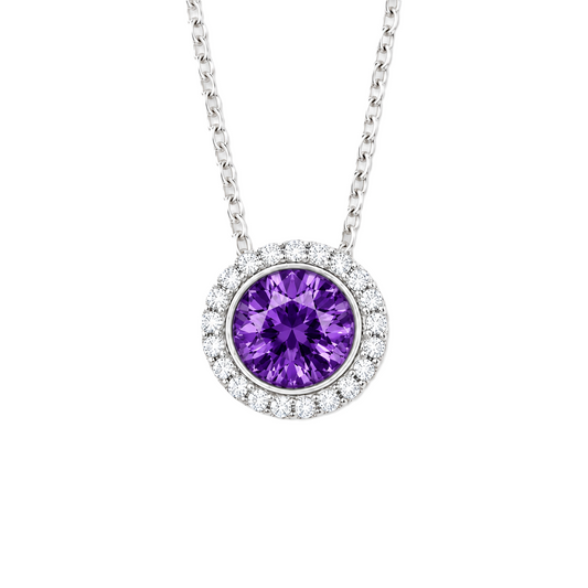 Purple sapphire pendant with 6 mm round stone in white gold-plated 925 silver, accented with moissanite and adjustable cable chain. Available now at BSI Jewelry.