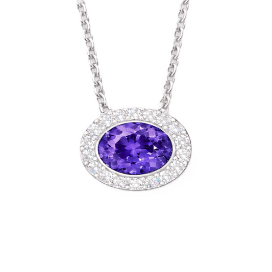 Purple sapphire pendant with a 7×5 mm oval stone in white gold-plated 925 silver, accented with moissanite. Elegant and refined. Available now at BSI Jewelry.