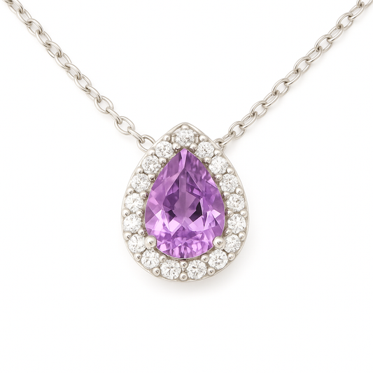 Elegant 7×5mm purple sapphire halo pendant accented with Moissanite, crafted in white gold-plated 925 silver and palladium alloy. Available now at BSI Jewelry.