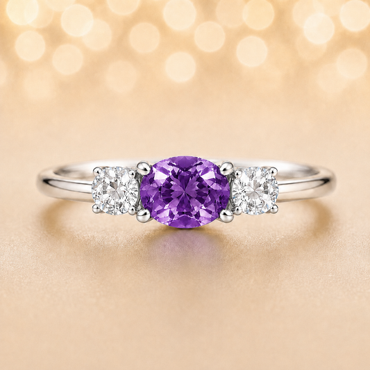 Purple sapphire ring, 5×4 mm oval with moissanite accents in white gold-plated 925 silver. Elegant and hypoallergenic. Available now at BSI Jewelry.