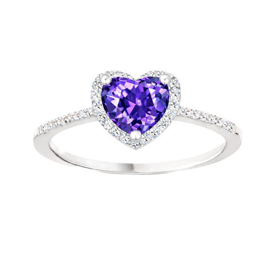 Purple sapphire ring with a 6 mm heart cut, accented by moissanite in white gold-plated 925 silver. Elegant and timeless. Available now at BSI Jewelry.