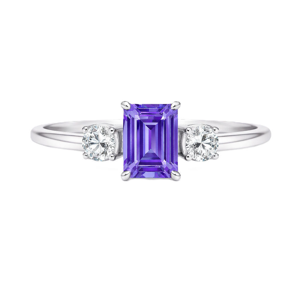 Purple sapphire ring, 6×4 mm emerald cut with 3 mm moissanite sides, set in white gold-plated 925 silver. Elegant and hypoallergenic. Available now at BSI Jewelry.