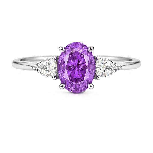 Purple sapphire ring with 7×5 mm oval center in white gold-plated 925 silver. Hypoallergenic silver for comfortable daily wear. Available now at BSI Jewelry.