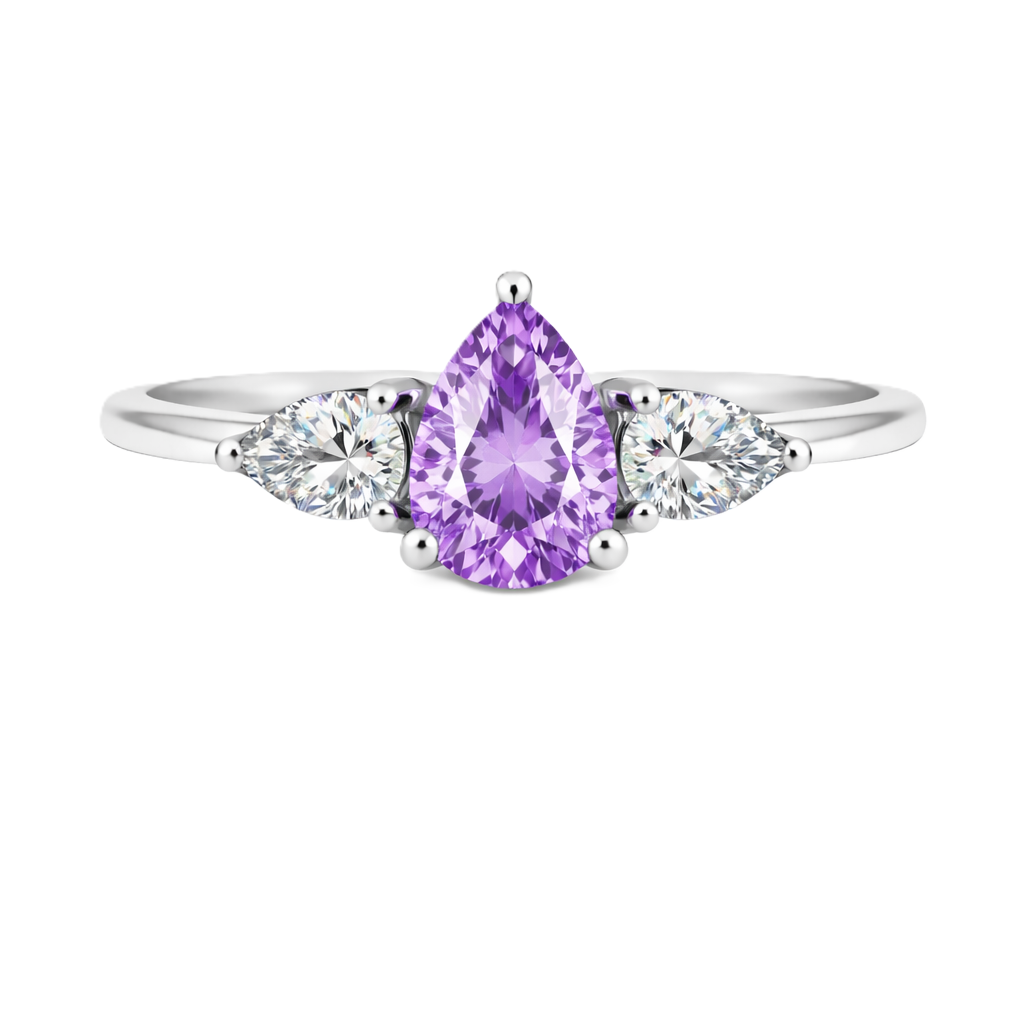 Purple sapphire ring with 7×5 mm pear center and side stones in white gold-plated 925 silver. Elegant and refined for daily wear. Available now at BSI Jewelry.
