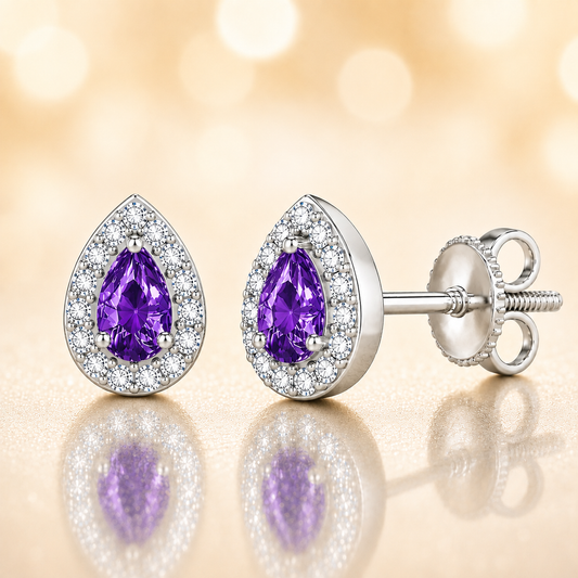 Purple sapphire stud earrings with 5×3 mm pear in white gold-plated 925 silver, accented with moissanite and secure screw-back posts. Available now at BSI Jewelry.
